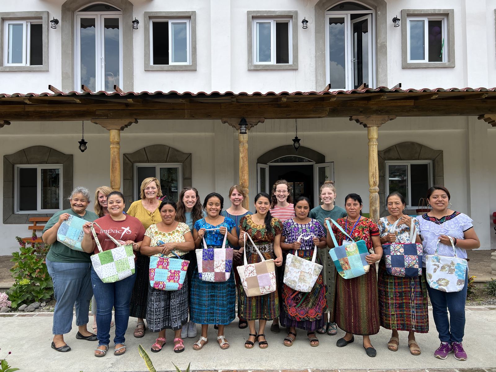 group in front of building aleluya
