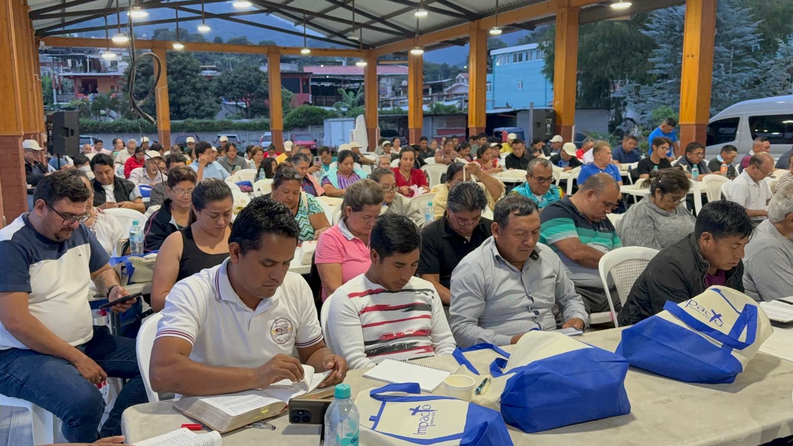 with blue shirts on table aleluya