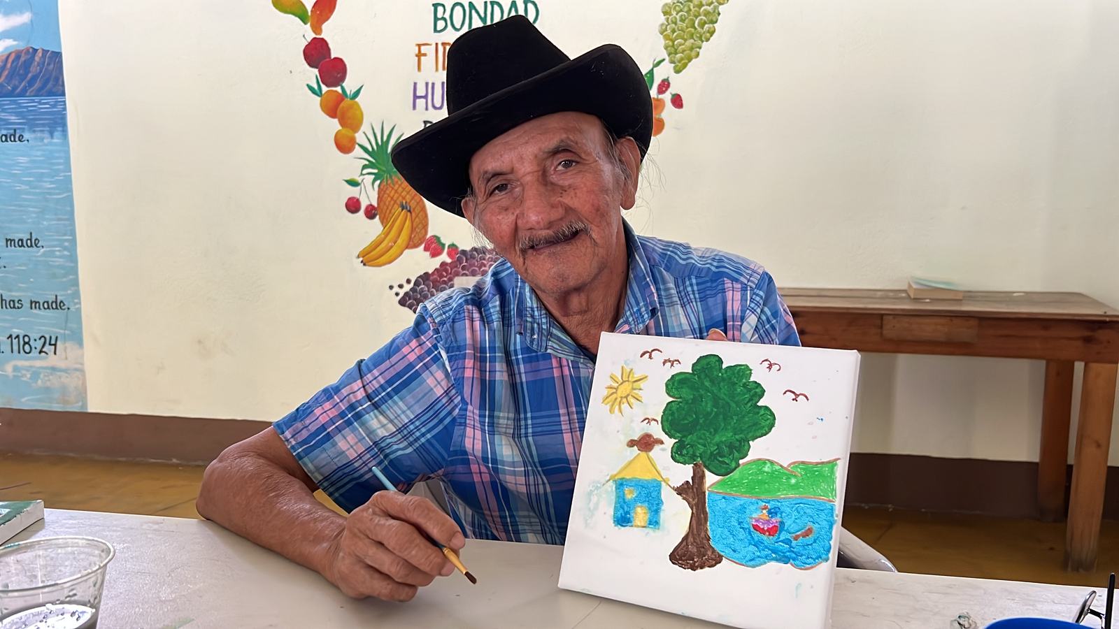 man painting aleluya