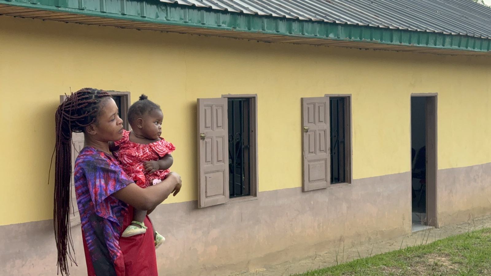 September 2026 mother and baby outside a church in Equatorial Guinea aleluya